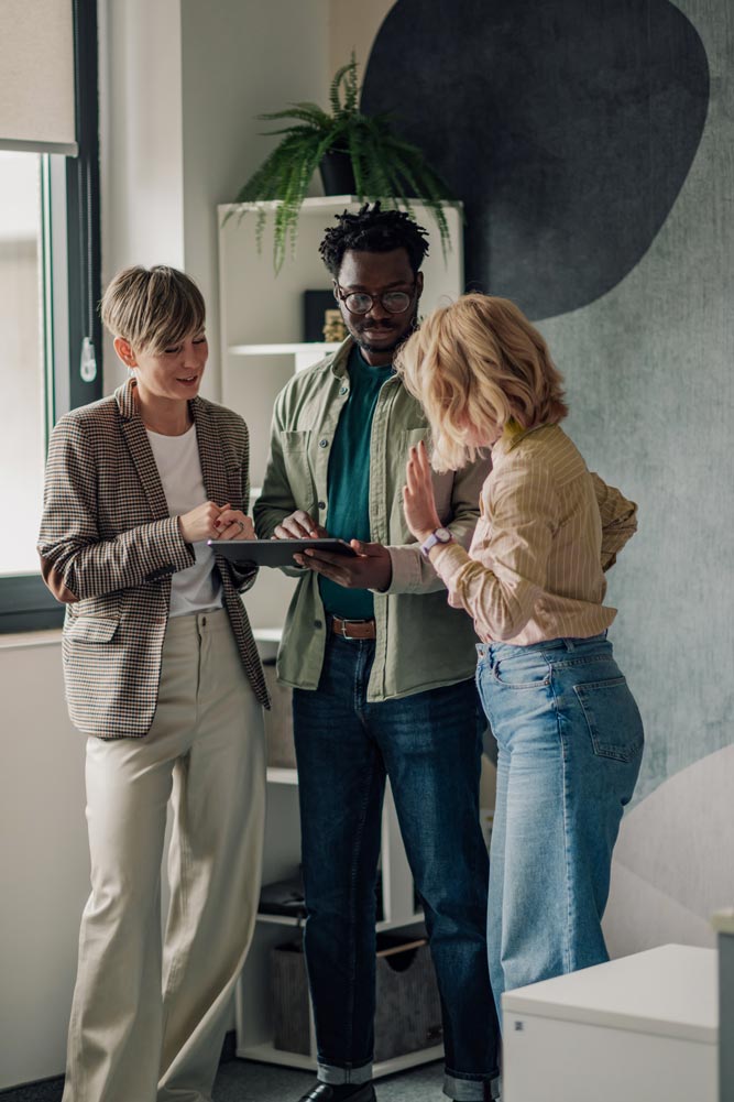 MBR-Connect-Mission-group-of-people-looking-at-a-tablet